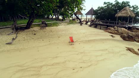 wooden comfortable chair on the morning beach clear sky and beautiful sea, copy space.