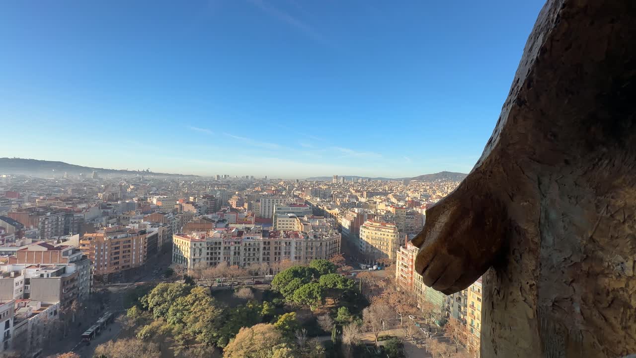 Barcelona, Spain, external detail of the Sacred Family cathedral under contstruction, artistic and sculptural details, view of the city on the background
