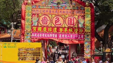 colorful festival entrance with bustling crowd