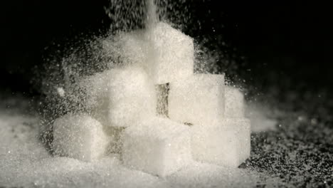 powdered sugar falling onto sugar cubes