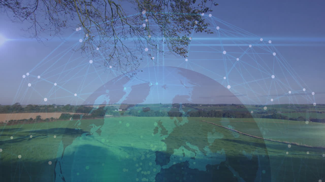 Digital globe overlaying green fields, networking bright nodes connecting rural landscape