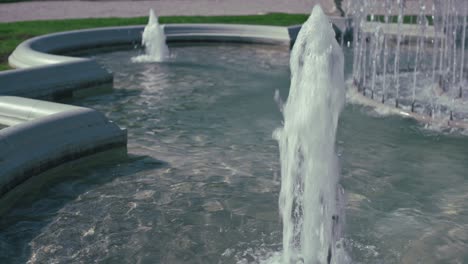 close up of flowing water jets in a fountain at king tomislav square, zagreb