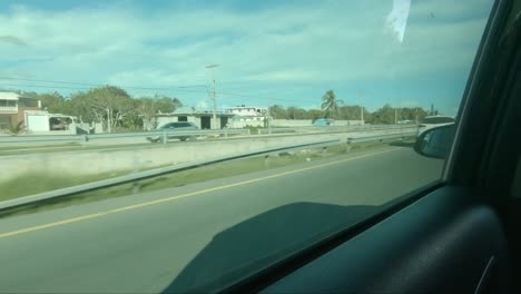 juan dolio, dominican republic - 2022: first person view of the main highway from inside a car, traveling around the country