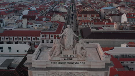 Close-up-aerial-view-of-monument-with-inscription-on-the-top-of-Arco-da-Rua-Augusta-in-Praca-do-Comercio-in-Lisbon-city-center