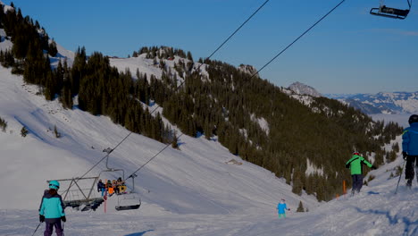 ski area in the swiss alps with people and chairlifts in the winter ski area of beckenried