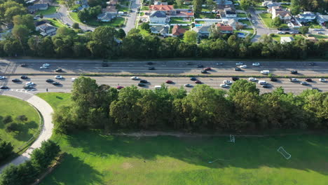 an aerial view of a parkway in the evening at rush hour