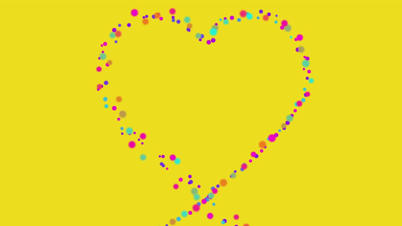 small colored particles and dots shaped heart on a yellow background. seamless looping animation