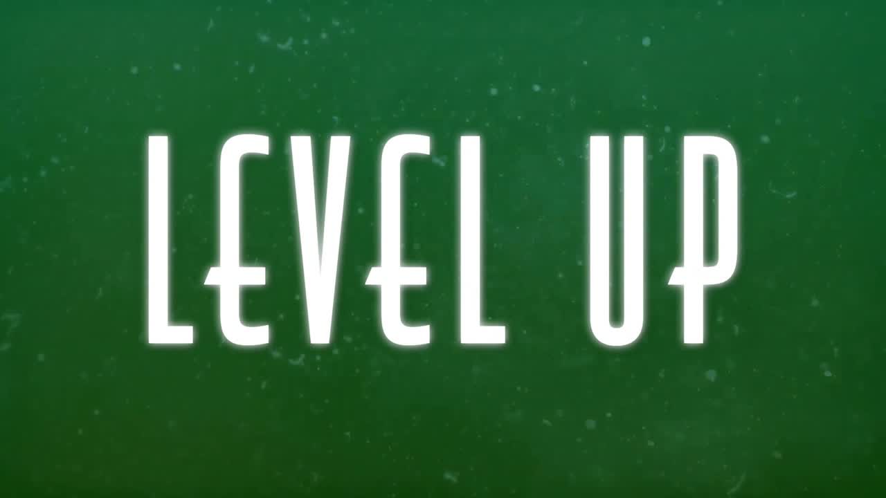 Level up text animation over green background with particles
