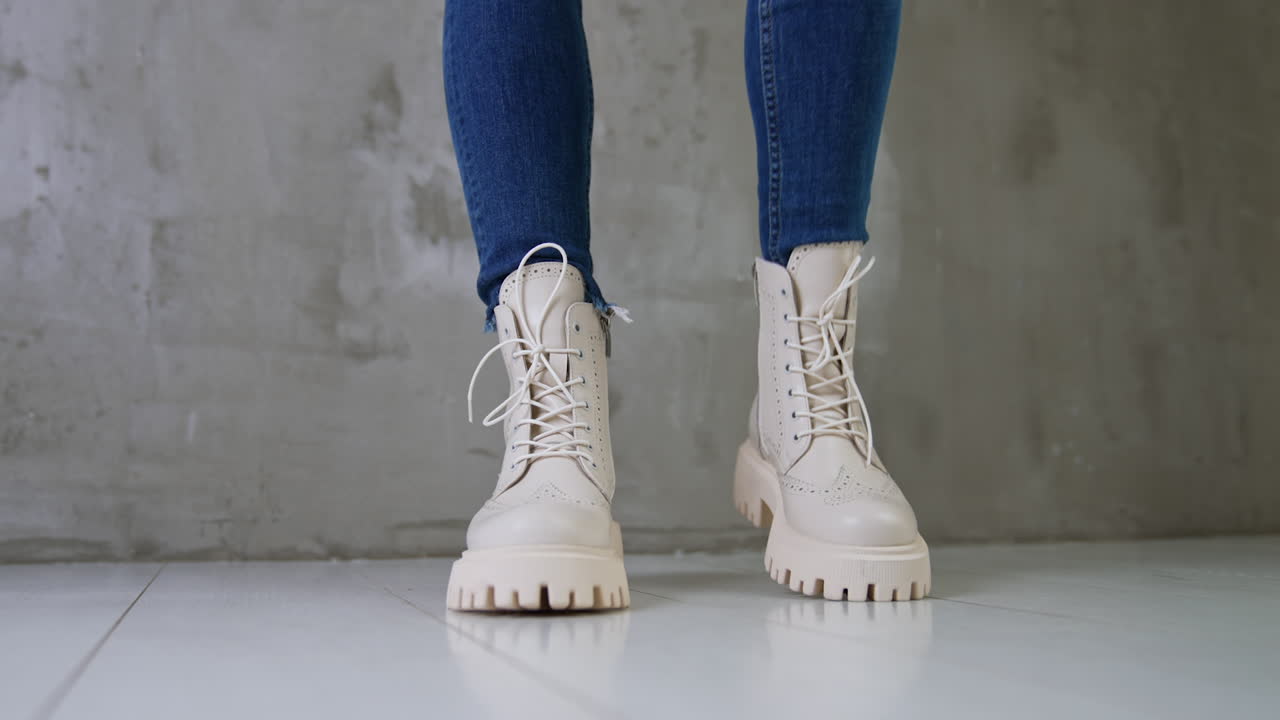 Cream Colored Platform Lace-up Boots on Women's Legs
