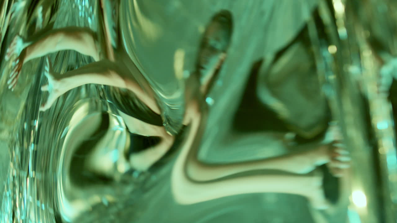 Female Dancer Moving with Grace through Distorted Reflections in Neon Light