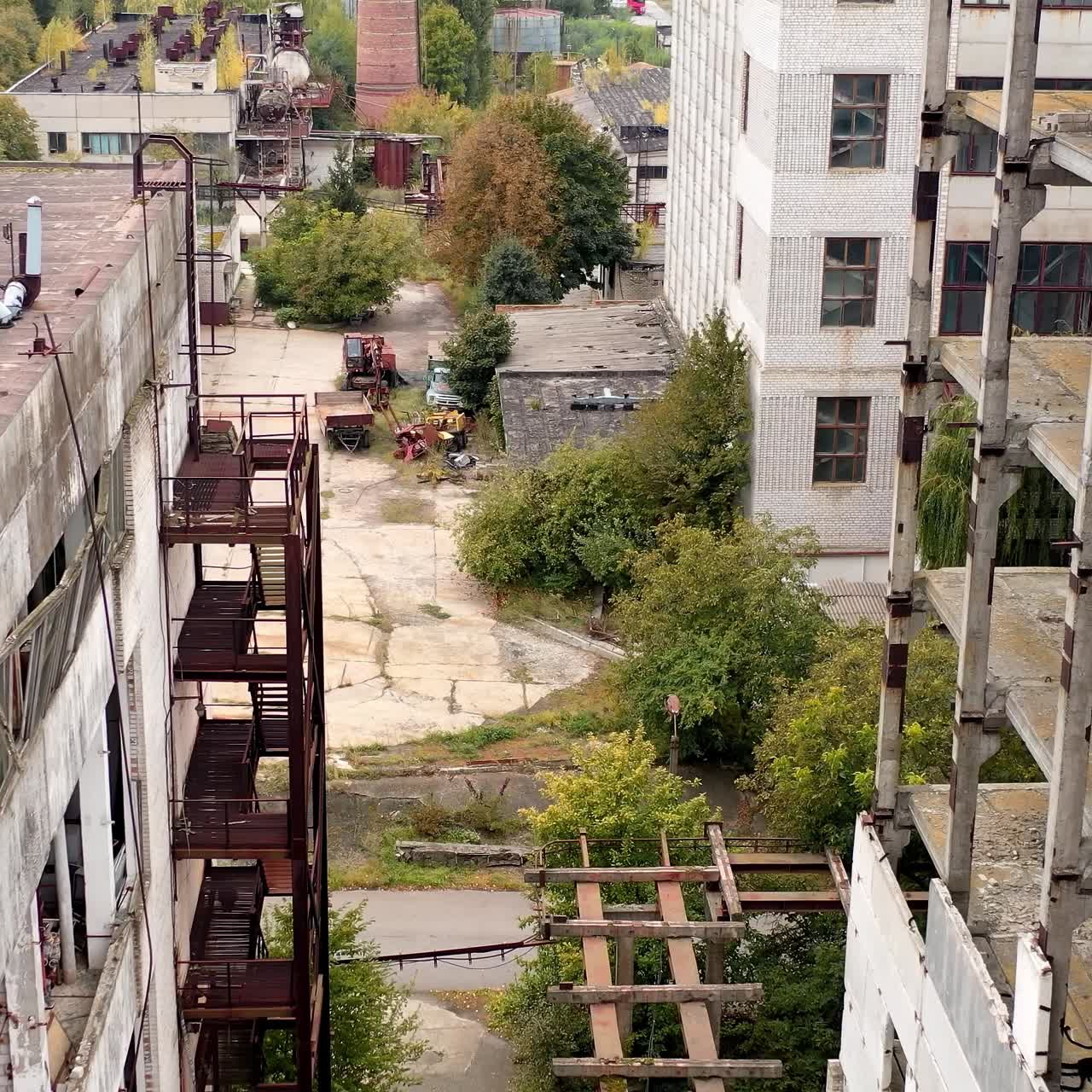 Aerial view of destructive abandoned architecture. Industrial destroyed city buildings