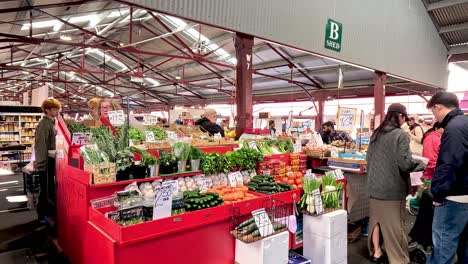 people shopping at a vibrant produce market