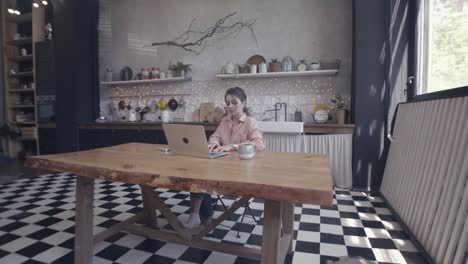 woman working from home in a modern kitchen