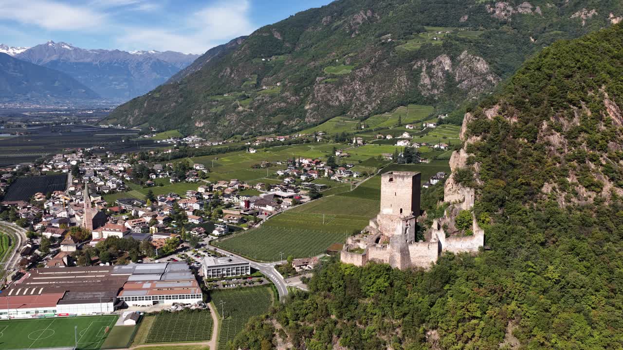 Neuhaus Castle Ruins Neuhaus Castel Maultasch, hill top castle. in the area of Terlano, Terlan. Overlooking valley of apple plantations. Aerial drone video