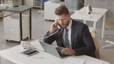 male trader working in office