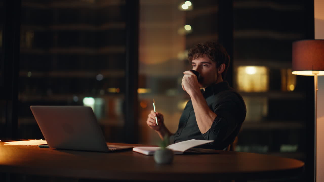 Pensive entrepreneur thinking project at night workspace. Thoughtful businessman