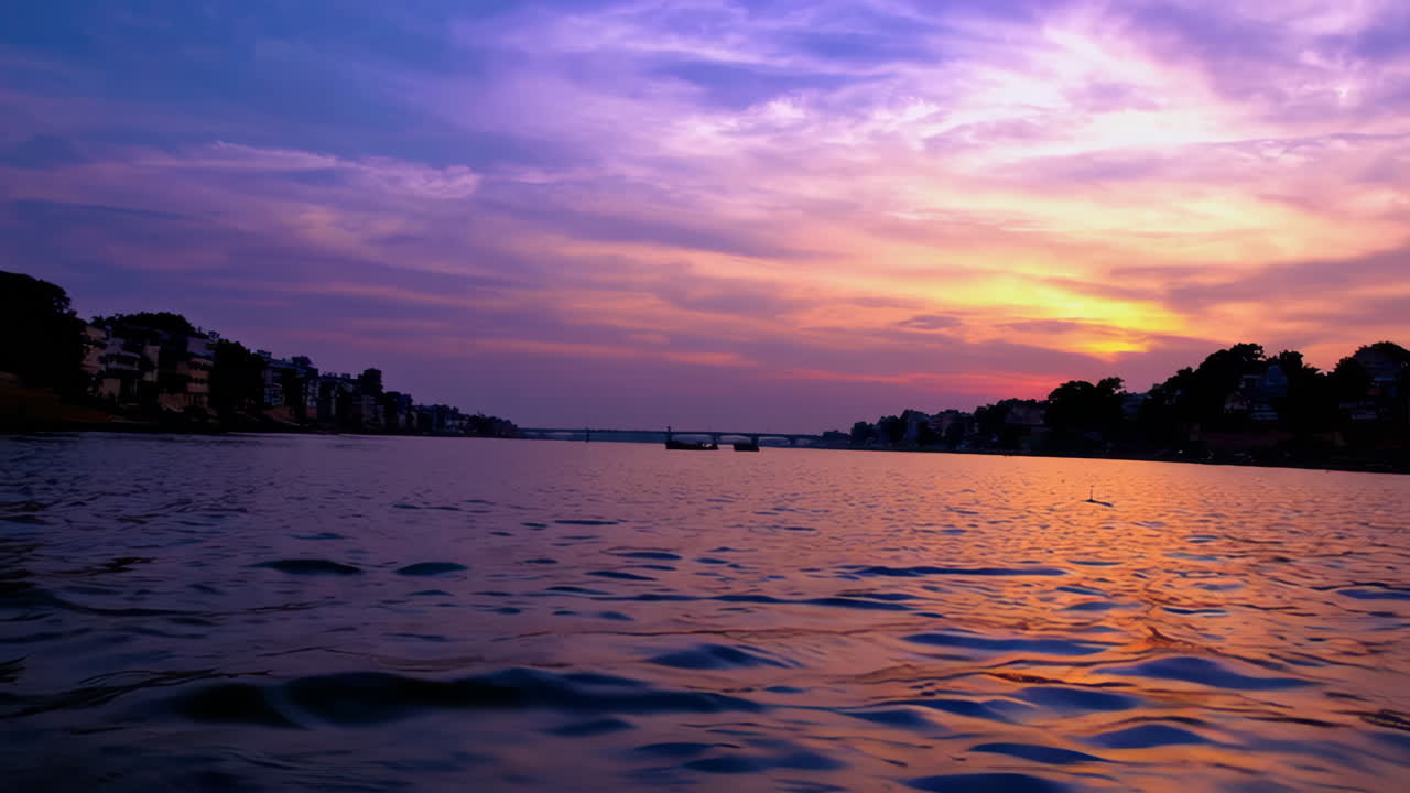 Vibrant Sunset or Sunrise over a River with City Reflections