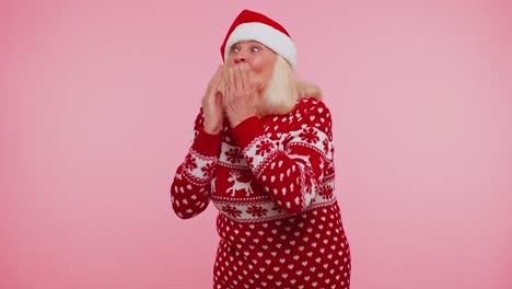 senior christmas grandmother sending lots of air kisses looking at camera smiling missing you love