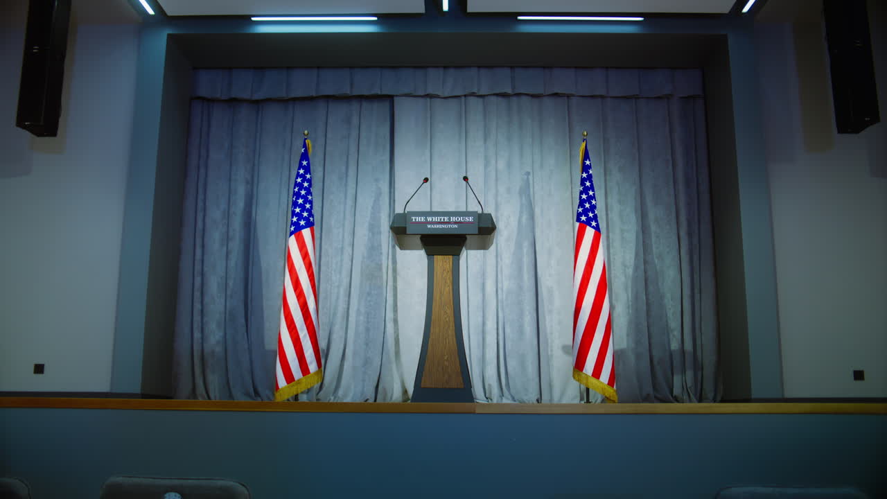 Speech tribune for US President or government representative in the White House. Press conference hall with seats. Wooden podium debate stand with microphones on stage. Backdrop with American flags.