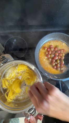 cooking pasta with red grapes