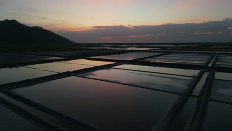 salt fields, mirror flat reflections of sunset