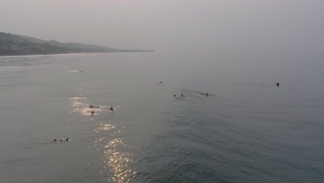 Aerial-Drone-Slow-Motion-view-of-Surfers-at-Sunrise-La-Bocana-El-Tunco-El-Salvador