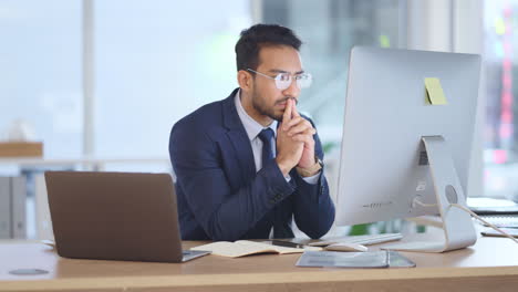 financial trader typing on computer keyboard