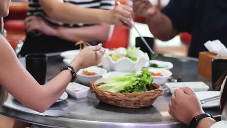 group of friends sharing food at a table