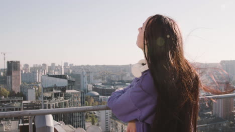 brunette woman on a terrace