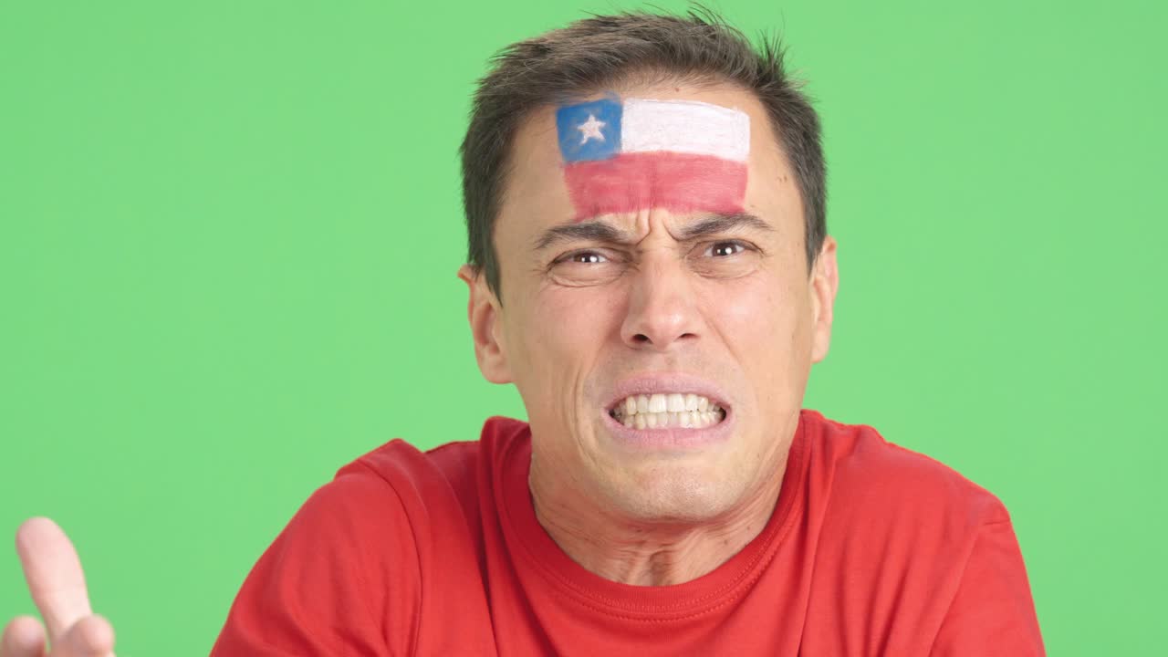 Man with chilean national flag upset with a referee