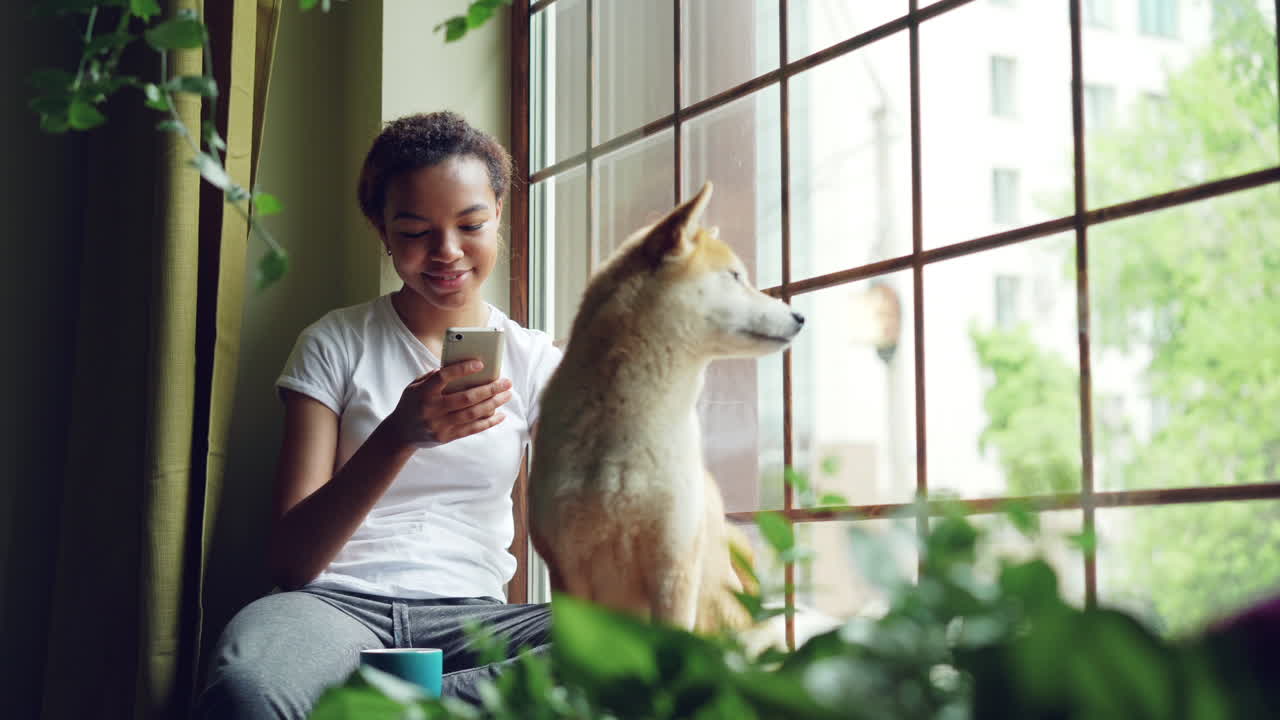 Young Woman with Dog by the Window