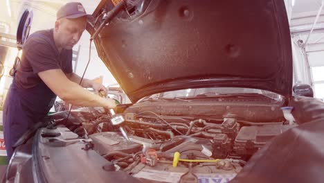 auto mechanic replacing engine oil under the hood. auto repair