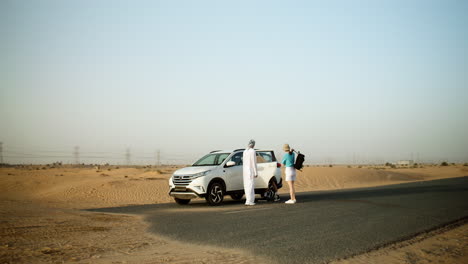 Couple-taking-backpacks-from-the-car