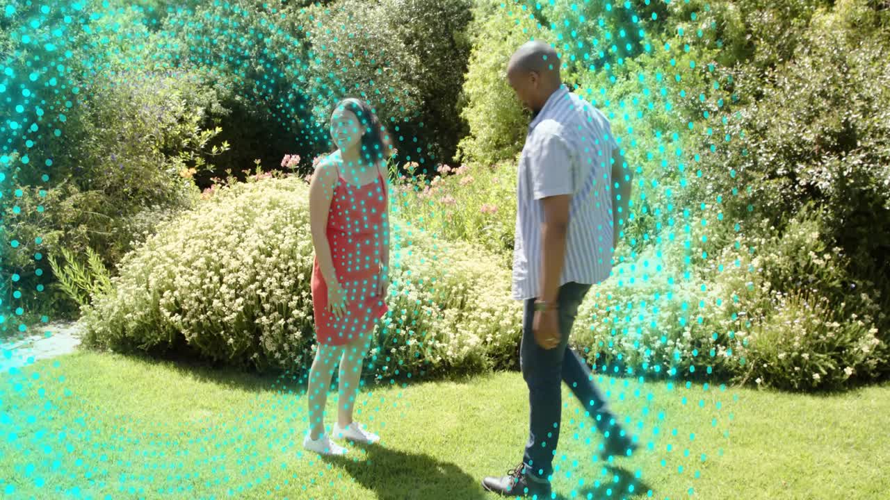 Man pointing, leading woman holding hands along path, turquoise halo encircling couple for wedding