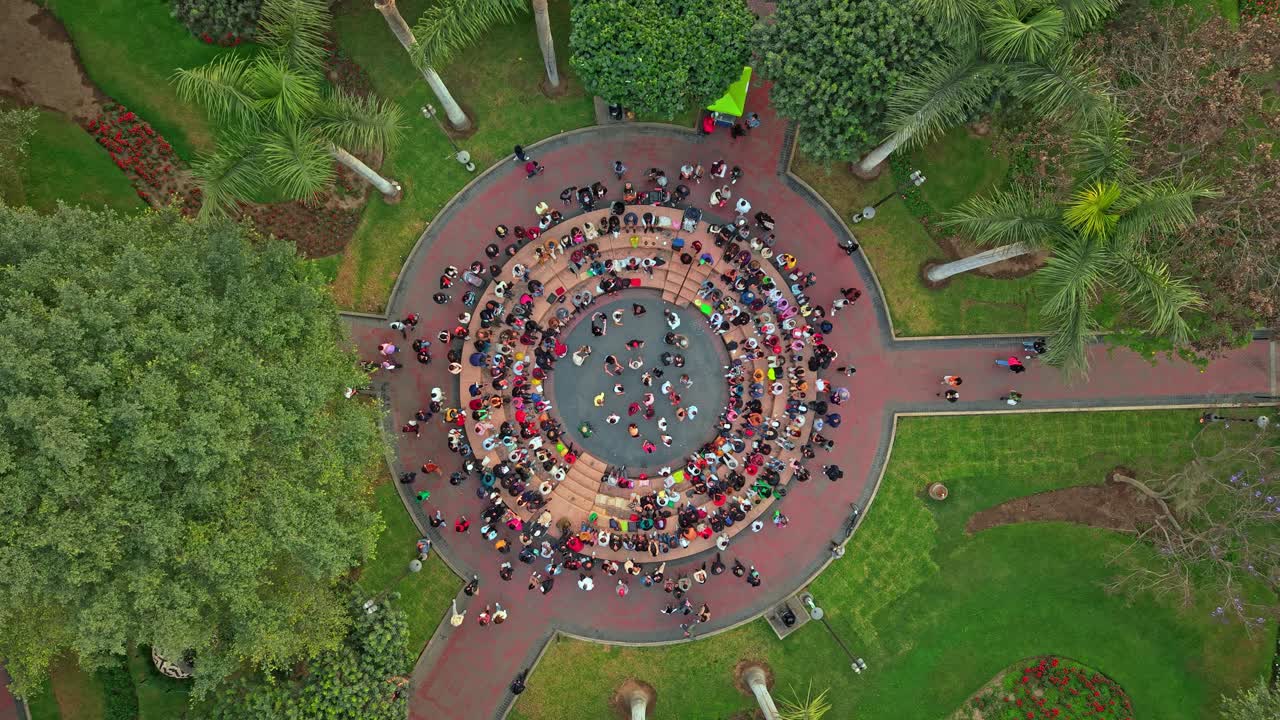 Aerial View of People Gathered in a Circular Park Amphitheater