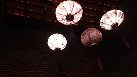 white chinese lantern hanging in an oriental style building interior