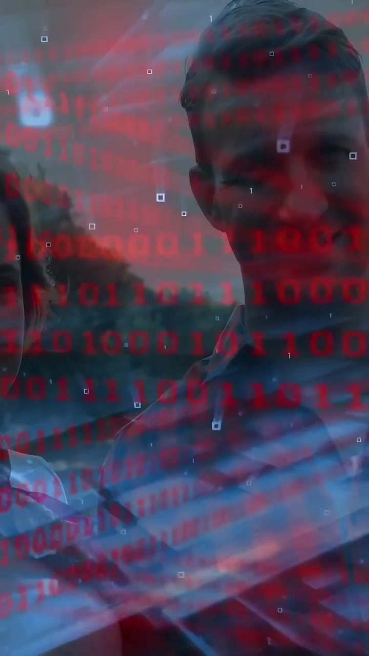 Vertical video: Male moving center as camera zooming, red binary revealing faces for tech portrait