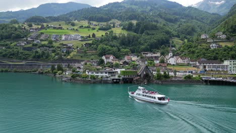 tourists back to walensee lake shores after enjoying boat cruise ride