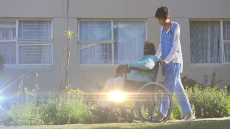 Animation-of-light-moving-over-nurse-pushing-senior-man-in-wheelchair