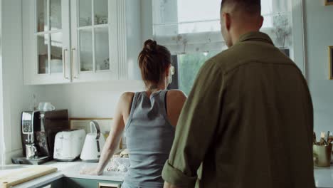 couple discussing in the kitchen