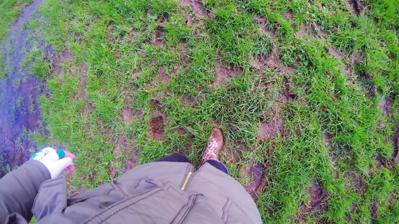 Woman filming her steps on the grass
