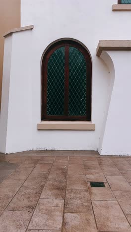 exterior building with arch window and safety cone