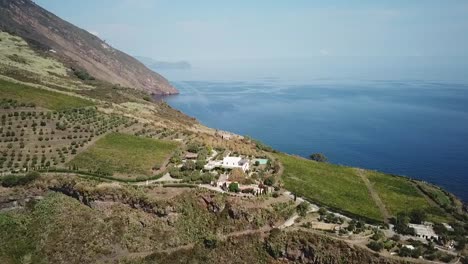 drone opening shot of the volcano island in italy, sicily, lipari archipelago. view on islands and sea.