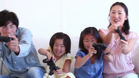 family happily playing a games console together