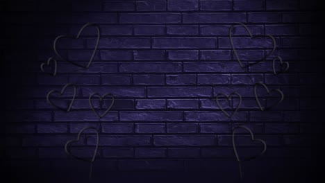 corazones de luz led en una pared de ladrillo