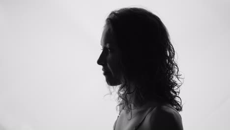 profile of a woman pointing