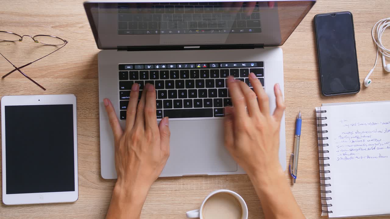 Person Working on Laptop at a Desk