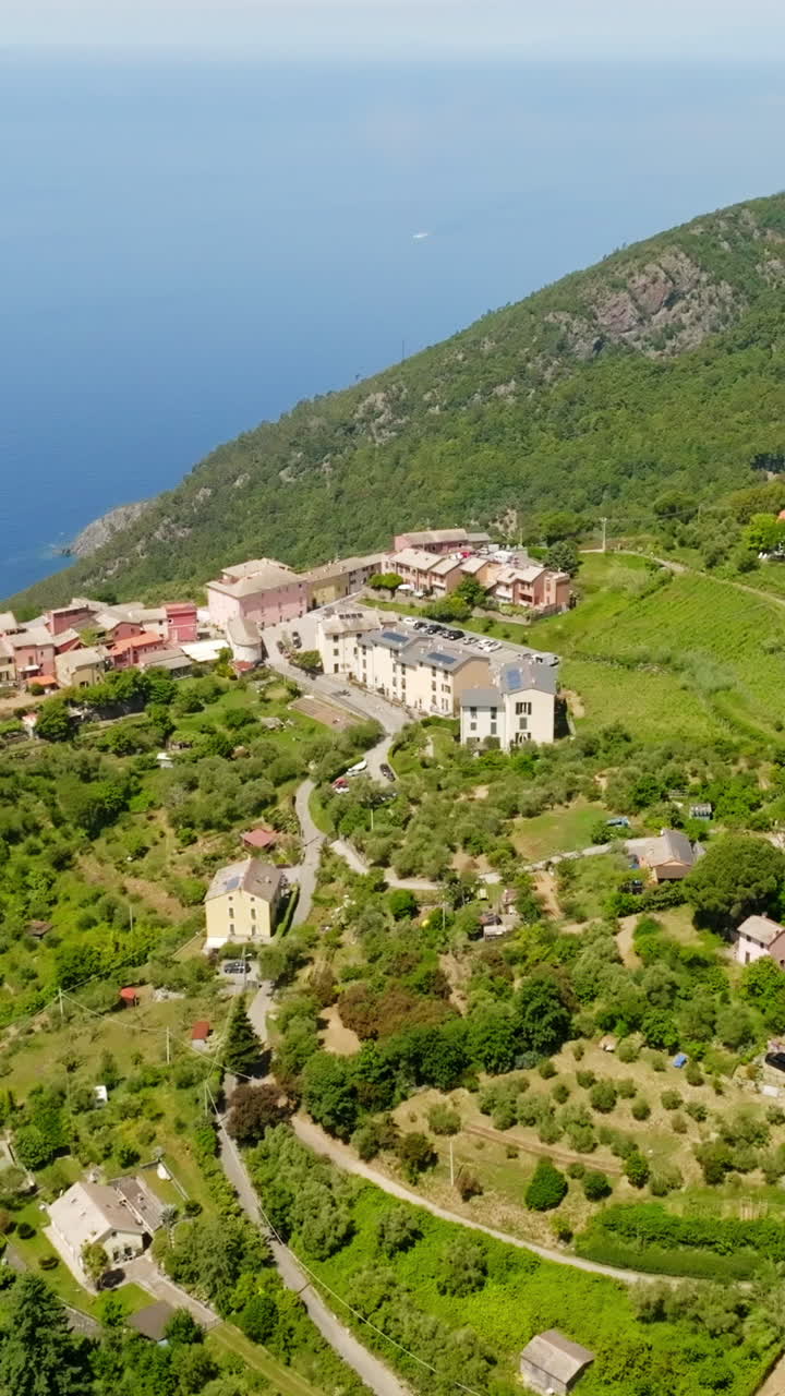 Aerial portrai in front of Montaretto on the elevated shoreline of Italy, summer