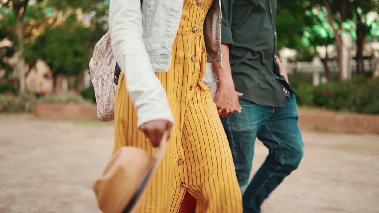 Couple walking outdoors in a park