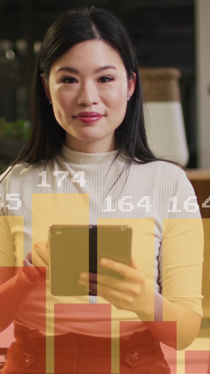 Animation of financial data processing over asian businesswoman working in office